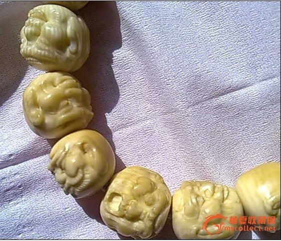 请求高人看下,十八罗汉手链,真假。价格。谢谢