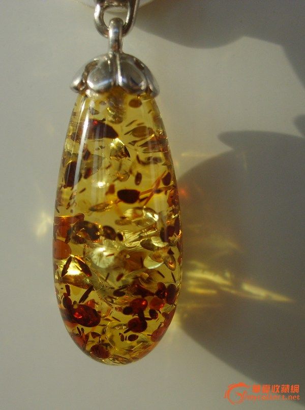 请老师们鉴别一下这个琥珀吊坠真假_请老师们