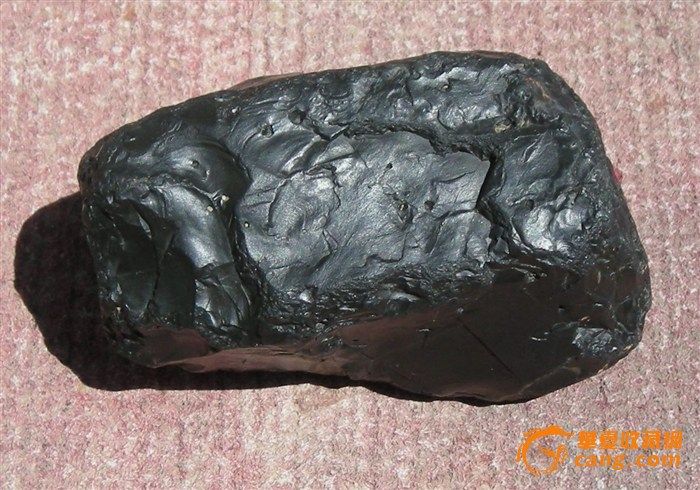 一块能滑动玻璃 滑动铁的黑石头,质量(比重)在