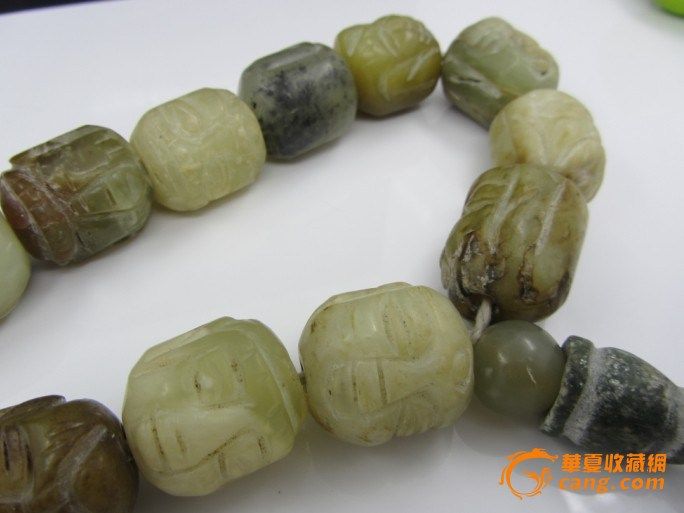 汉代清白玉雕佛头手串_汉代清白玉雕佛头手串